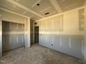 Unfinished bedroom with drywall, ready for customization, and two doorways at 246 Norman Ave, Lillington, NC 27546