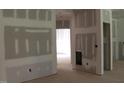 Living room showing the construction, featuring a fireplace and ample space at 25 Autumnwood Ln, Spring Hope, NC 27882