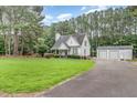 Charming home with well-manicured lawn and a detached two-car garage at 255 Morris Rd, Pittsboro, NC 27312