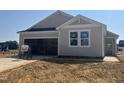 One-story home with gray siding and white trim, and a two-car garage under construction at 256 Norman Ave, Lillington, NC 27546