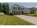 Charming two-story home with a two-car garage and landscaping at 2586 Lacey Holt Rd, Graham, NC 27253