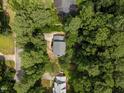 Aerial view of a home surrounded by lush green trees, offering privacy and a serene setting at 308 Fleming Dr, Durham, NC 27712