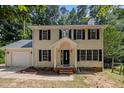 Beautiful two-story home with black shutters, a covered front porch, and an attached garage at 308 Fleming Dr, Durham, NC 27712