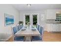 Stylish dining area with seating for six, adjacent to the kitchen, bathed in natural light at 308 Plaza Dr, Garner, NC 27529