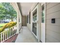 View of the spacious front porch, featuring a screen door and Ring doorbell at 316 Academia Ct, Durham, NC 27713