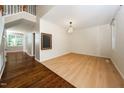 Open-concept living room showcasing hardwood floors and plenty of natural light at 316 Academia Ct, Durham, NC 27713