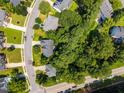 Residential neighborhood featuring mature trees and well-maintained homes at 3306 Meadowrun Dr, Durham, NC 27707