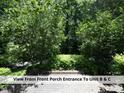 View from the front porch towards lush greenery and the entrances to units B & C at 407 Coolidge St # A, Chapel Hill, NC 27516