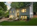 Beautifully renovated home with fresh exterior paint, updated windows, and manicured front yard landscaping at 4349 Pickwick Dr, Raleigh, NC 27613