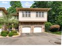 Charming townhouse with stone accents and attached two-car garage at 4831 Crestmore Rd # 202, Raleigh, NC 27612