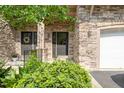 Close up of entrance doors with stone exterior and black doors at 4831 Crestmore Rd # 202, Raleigh, NC 27612