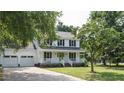 Charming two-story home featuring a spacious front porch and a well-maintained lawn at 505 Commander Dr, Wendell, NC 27591