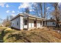 Single-story home featuring a cozy front porch and low-maintenance yard at 112 Edgewood Dr, Roxboro, NC 27573