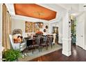 Elegant dining room with decorative ceiling and hardwood floors at 1806 Pattersons Mill Rd, Durham, NC 27703