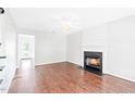 Hardwood floors, bright walls, and a cozy fireplace define this welcoming living space at 2419 Pepperstone Dr, Graham, NC 27253