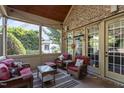 Cozy screened porch with comfortable seating and views of the surrounding landscape at 3311 Canoe Brook Pkwy, Raleigh, NC 27614