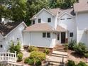Charming two-story home with landscaped front yard and entrance stairway at 3811 Carnegie Ln, Raleigh, NC 27612