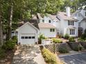 Charming two-story home with landscaped front yard and detached garage at 3811 Carnegie Ln, Raleigh, NC 27612