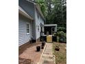 The home features a brick patio and screened in back porch, perfect for entertaining at 3821 Whispering Branch Rd, Raleigh, NC 27613