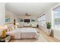 Spacious bedroom featuring a king bed, sitting area, plush carpet, and ample natural light at 410 Stranraer Ct, Fuquay Varina, NC 27526