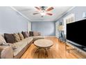 Cozy living room with hardwood floors, natural light, and comfortable seating at 410 W Tenth St, Siler City, NC 27344