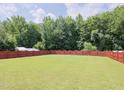 Expansive, fully-fenced backyard, perfect for outdoor activities and privacy at 412 Onondaga Ct, Holly Springs, NC 27540