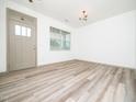 Inviting space with wood-look floors, bright lighting, and a large window at 425 Sunny Field Dr., Wake Forest, NC 27587