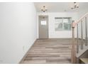 Spacious living room with wood-look floors, neutral paint, and natural light at 425 Sunny Field Dr., Wake Forest, NC 27587