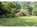 Attractive home boasting a lush green lawn and a lovely, fenced front yard at 6412 Forest Ridge Dr, Durham, NC 27713