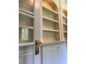 Close up of an elegant built-in shelving with classic white cabinetry at 8512 Barrett Hall Ln, Wake Forest, NC 27587