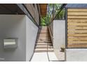 Exterior wooden staircase that leads to a modern, custom-built home at 922 Tower St, Raleigh, NC 27607