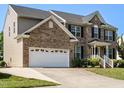 Beautiful two-story brick home with a two-car garage and well maintained landscaping at 1035 Evening Shade Ave, Rolesville, NC 27571