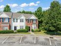 Exterior shot of townhomes with designated parking spaces and well-kept landscaping at 2833 Gross Ave, Wake Forest, NC 27587