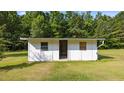 Exterior view of a white-painted shed, offering potential for storage or workshop space at 3701 Oak Grove Church Rd, Mebane, NC 27302