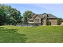 Spacious backyard featuring a private swimming pool surrounded by a secure fence and mature trees at 39 Wood Stork Ct, Clayton, NC 27520
