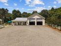 Aerial shot of large multi-car garage and workshop space, perfect for hobbyists or storing equipment at 4050 Culbreth Rd, Stem, NC 27581