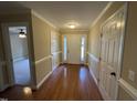 Inviting foyer with hardwood floors and plenty of natural light at 421 Braxman Ln, Holly Springs, NC 27540