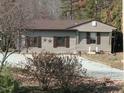 Charming home featuring neutral siding, shutters, and a gravel driveway at 4254 Bowmantown Rd, Roxboro, NC 27574