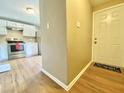 Inviting entryway features a wood-look floor and a front door with a 'Welcome' mat at 4324 Halliwell Dr, Raleigh, NC 27606