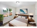 Comfortable bedroom featuring a plush bed, stylish decor, and a large bright window at 448 Chinaberry Ln, Angier, NC 27501
