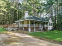 Exterior view of the home with a spacious deck and wraparound porch at 45 Softwood Dr, Franklinton, NC 27525