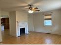 Spacious living room featuring a decorative fireplace and hardwood floors at 462 Ashland Dr, Goldston, NC 27252