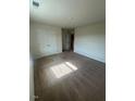 A cozy bedroom featuring carpet and a large closet, bathed in natural light at 484 Crow Field St, Roxboro, NC 27574