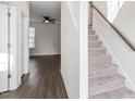 Inviting entryway featuring hardwood floors and a staircase leading to the upper level at 485 Hawksbill Dr, Franklinton, NC 27525
