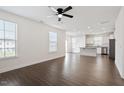 Bright living room with an open layout, hardwood floors, and windows at 485 Hawksbill Dr, Franklinton, NC 27525
