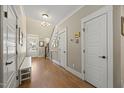 Bright foyer with hardwood floors and white trim throughout at 512 Mill Hopper Ln, Apex, NC 27502