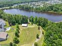 Scenic aerial view of a lake and walking trails offering tranquil escape and recreation within the community at 529 Lake Gaston Dr, Fuquay Varina, NC 27526