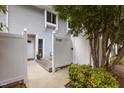 Charming townhome exterior with white privacy fence and cozy entry area at 7159 Sandy Creek Dr, Raleigh, NC 27615