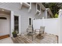Comfortable patio seating area with privacy fence provides a relaxing outdoor space at 7159 Sandy Creek Dr, Raleigh, NC 27615