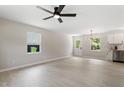 Open living room boasts new flooring, updated lighting, and leads to a modern kitchen at 768 Lunar Dr, Raleigh, NC 27610